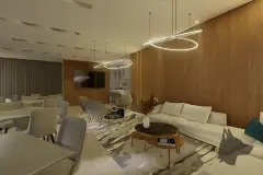 Salão de festas com sofás, mesas de jantar e luminária de LED circular suspensa — Recanto dos Corais em Abraão, Florianópolis