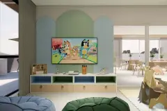 perspectiva ilustrativa brinquedoteca kids TV verde arcade mesas cadeiras puf janela vista — Residencial Armazém Vieira em Saco dos Limões, Florianópolis