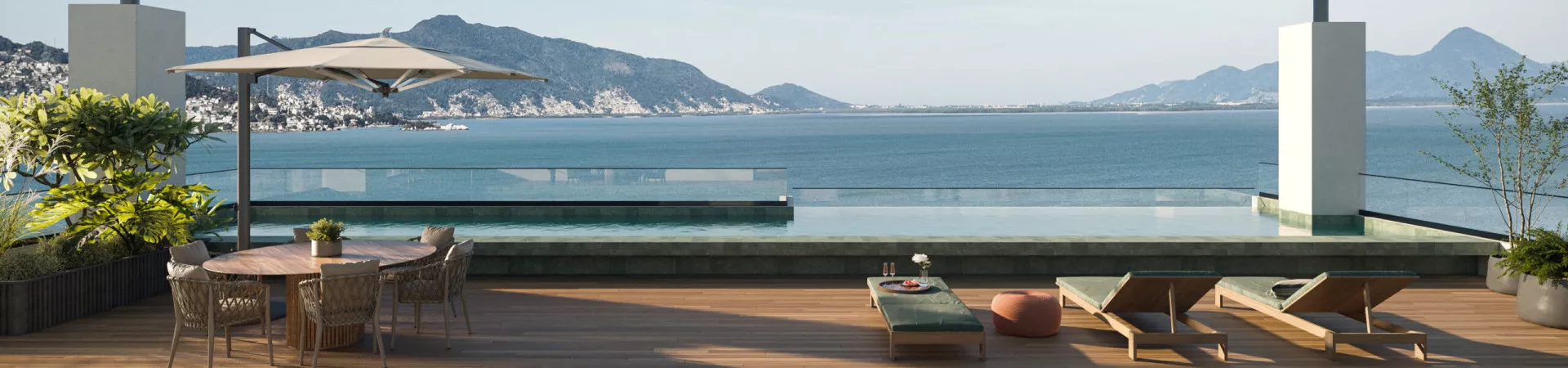 perspectiva ilustrativa rooftop piscina infinita deck madeira mesa redonda cadeiras guarda-sol espreguiçadeiras almofadas verdes vista baía montanhas dia ensolarado — Residencial Blue Bay em Coqueiros, Florianópolis
