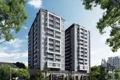 Fachada dos dois edifícios de dia com vegetação ao redor e céu azul — Rosa Branca em Canto, Florianópolis
