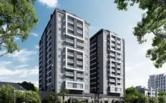 Fachada compacta dos dois edifícios enquadrados entre árvores — Rosa Branca em Canto, Florianópolis