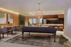 Salão de jogos com mesa de sinuca, sofás, TV e cozinha integrada ao fundo — Rosa Branca em Canto, Florianópolis