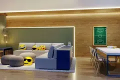 Sala de jogos teens com sofás, pufes emoji, mesa de jogos e painel decorativo de campo de futebol na parede — Rosa Branca em Canto, Florianópolis