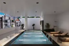 Área da piscina coberta com espreguiçadeiras de vime, cascata e plantas, ângulo frontal — Saint Humbert II em Ingleses, Florianópolis