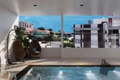 Área da piscina coberta com espreguiçadeiras junto à parede com cascata e plantas, ângulo relaxamento — Saint Humbert II em Ingleses, Florianópolis