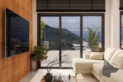 Varanda com vista panorâmica para a praia e morro verde com palmeira em vaso — Saint Humbert II em Ingleses, Florianópolis