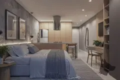 Estúdio decorado com cama, ilha de cozinha, escrivaninha, armários embutidos e luminária pendente — Saint Zambelli em Ingleses, Florianópolis