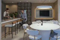 Salão de festas com bancada de bar e banquetas, mesa de jantar redonda, TV e sofás — Saint Zambelli em Ingleses, Florianópolis