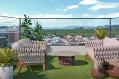 Suíte com cama de casal e colcha amarela, varanda ajardinada com poltronas e vista panorâmica da cidade — Santa 4 em Santa Mônica, Florianópolis