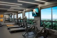 Academia equipada com esteiras, bicicleta ergométrica e TV, janelas panorâmicas com vista para o verde — Seleto Carlessi em Trindade, Florianópolis