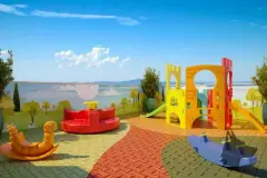 Playground externo com escorregador, gira-gira e brinquedos coloridos com painel decorativo ao fundo — Seleto Carlessi em Trindade, Florianópolis