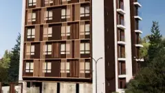 Fachada do edifício em perspectiva frontal com revestimento marrom e ripas de madeira — Smart 1 Trindade em Trindade, Florianópolis