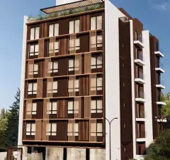 Fachada do edifício em perspectiva diagonal com revestimento marrom, ripas de madeira e jardim no rooftop — Smart 1 Trindade em Trindade, Florianópolis