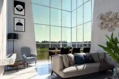 Sala de estar de pé direito duplo com sofá cinza, poltrona azul, mesa de jantar e parede envidraçada — Solis em Ingleses, Florianópolis