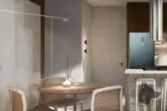 Sala de jantar compacta com mesa redonda, cadeiras de fibra e cozinha integrada ao fundo — Terracota em Morro das Pedras, Florianópolis