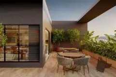 Terraço privativo com deck de madeira, mesa redonda, cadeiras e plantas ao redor — Unity em Estreito, Florianópolis