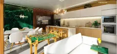Pub festas com mesa de pebolim dourada, cozinha equipada, sofá branco e parede de mármore verde — Unna Studios em Trindade, Florianópolis