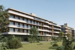 Fachada de 4 andares com varandas e jardim com palmeiras ao entardecer — Upside Beach em Ponta das Canas, Florianópolis