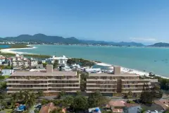 Vista aérea dos dois blocos do empreendimento com praia de Ponta das Canas e baía ao fundo — Upside Beach em Ponta das Canas, Florianópolis