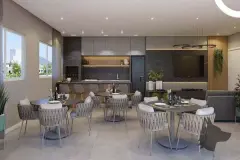 Salão de festas interno com mesas redondas, cadeiras trançadas, bancada de mármore cinza e TV na parede — Viel Spaβ em Ingleses, Florianópolis