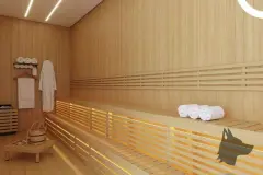 Sauna seca com bancos de madeira clara em dois níveis, roupão pendurado e toalhas enroladas — Viel Spaβ em Ingleses, Florianópolis