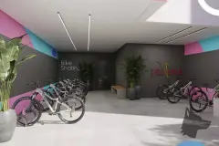 Bicicletário bike sharing com bicicletas de montanha e elétrica expostas e logo do empreendimento na parede — Viel Spaβ em Ingleses, Florianópolis
