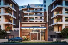 Render noturno da fachada principal com entrada iluminada, revestimento em tijolos e varandas amplas — Villa Maggiore em João Paulo, Florianópolis