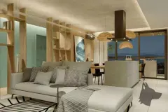Sala de estar decorada com sofá bege, pendentes de bambu, estante de madeira e vista noturna da varanda — Viva Balneário Estreito em Balneário, Florianópolis