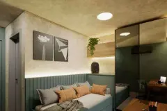 Dormitório juvenil com daybed azul-acinzentado, almofadas laranjas, painel ripado e espelho na porta do guarda-roupa — Viva Balneário Estreito em Balneário, Florianópolis