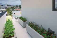 Horta urbana no rooftop com canteiros elevados de alface e morangos e vista para as montanhas — VYU One em Coqueiros, Florianópolis