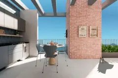 Varanda gourmet com churrasqueira embutida, mesa redonda, pérgola e vista para o céu azul — VYU Pulse em Coqueiros, Florianópolis
