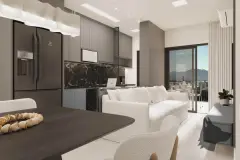 Sala integrada com cozinha escura, geladeira duplex, bancada de mármore e sofá branco com varanda — VYU Pulse em Coqueiros, Florianópolis