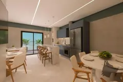 Cozinha integrada com armários azuis, bancada de mármore, ilha com bancos e mesa de jantar — VYU Pulse em Coqueiros, Florianópolis