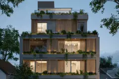 Fachada frontal do edifício ao entardecer com varandas e jardins suspensos em vista mais ampla — Yuná Blue View em Campeche, Florianópolis