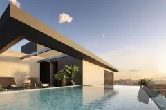 Piscina no rooftop ao entardecer com pergolado de concreto e vista para a cidade ao fundo — Yunic Haus Studios em Canasvieiras, Florianópolis