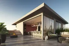 Área gourmet no rooftop com bancada bar, poltrona suspensa e sofá externo — Yunic Haus Studios em Canasvieiras, Florianópolis